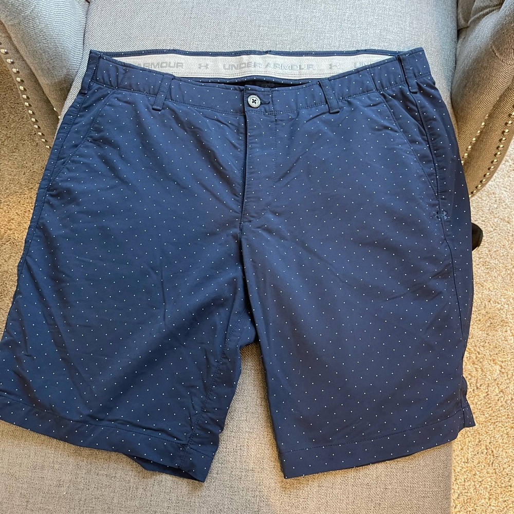 - Under Armour HeatGear Loose Fit Golf Casual Shorts. Navy blue with tiny dots.